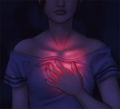 Woman with a hand to her heart
